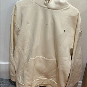 Lux Cream Hoodie with Black-and-Cream Reclining Figure Graphic